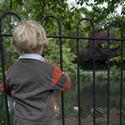 Boy looking at pond