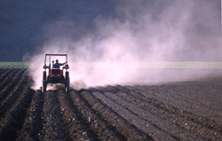 Farmer tractor on field